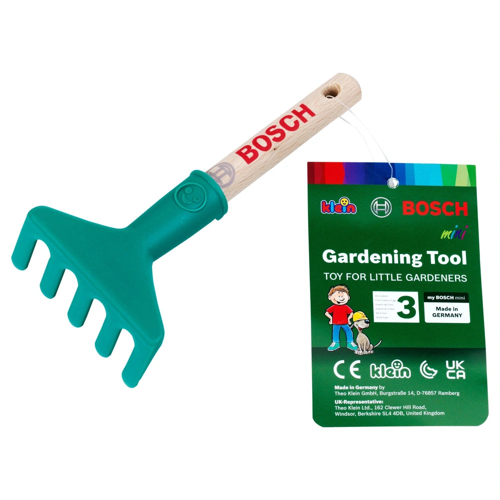 Theo Klein Bosch Garten hand rake with green plastic head, wooden handle, and cardboard packaging featuring various texts.