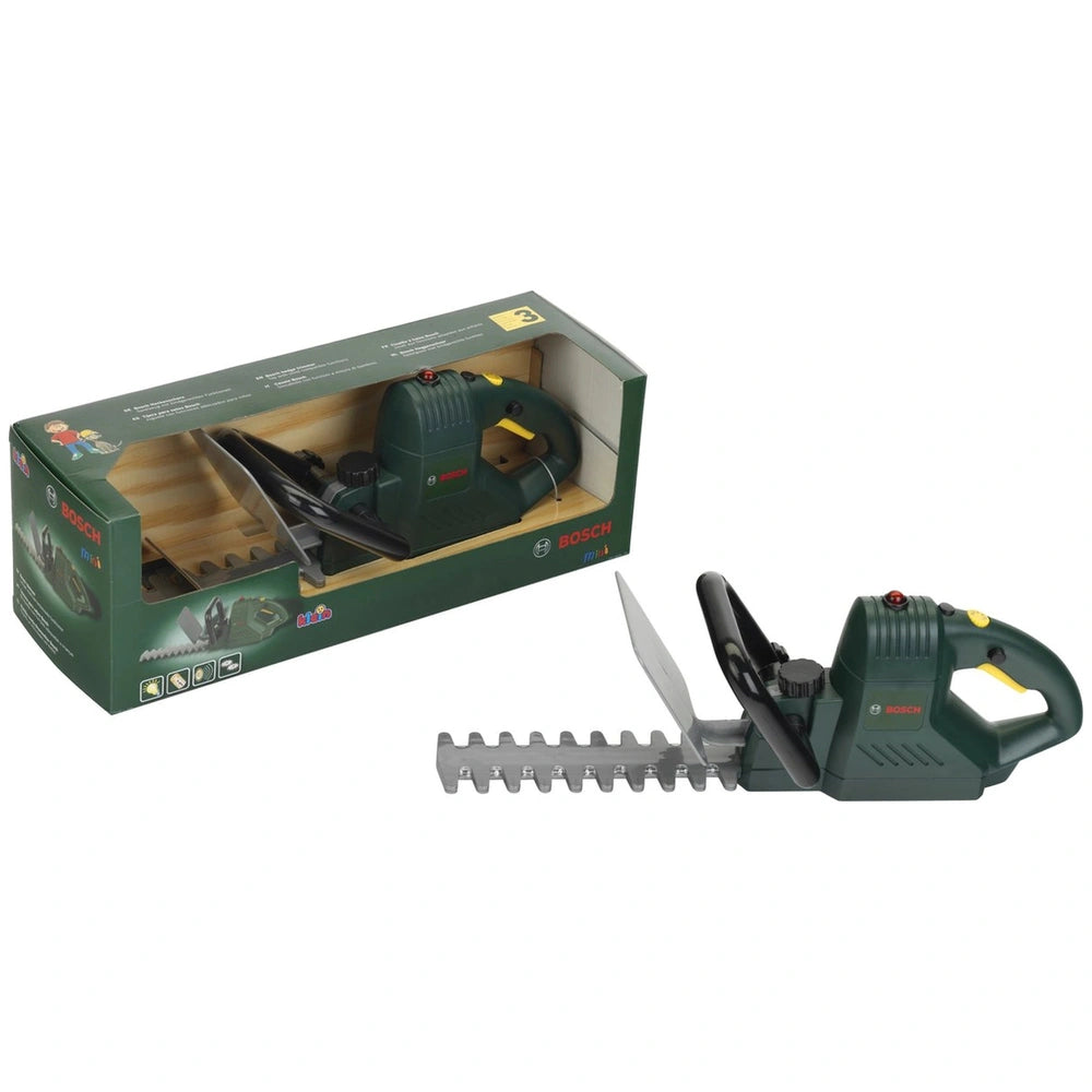 Theo Klein Bosch hedge trimmer in green box with plastic window, featuring a silver blade and black rubber grip.