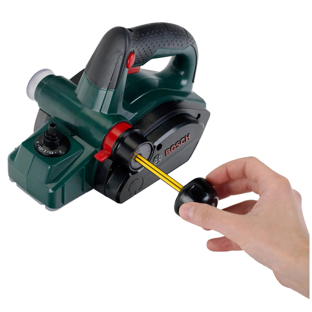 Theo Klein Bosch planer in green plastic with a textured black handle, featuring multiple buttons and a dial for pretend play