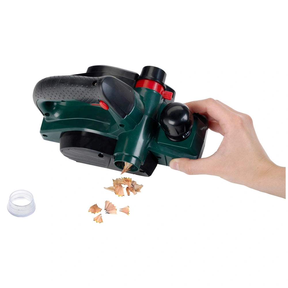 Theo Klein Bosch planer in dark green matte plastic with a handle and trigger, surrounded by wood shavings.