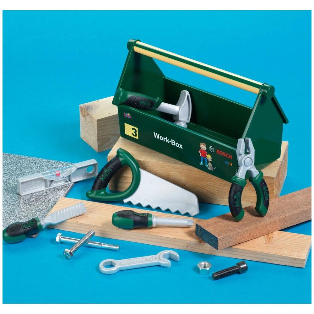 Theo Klein Bosch Work Box features a green toolbox, metal tools, wooden planks, and a blue cardboard box with "3".