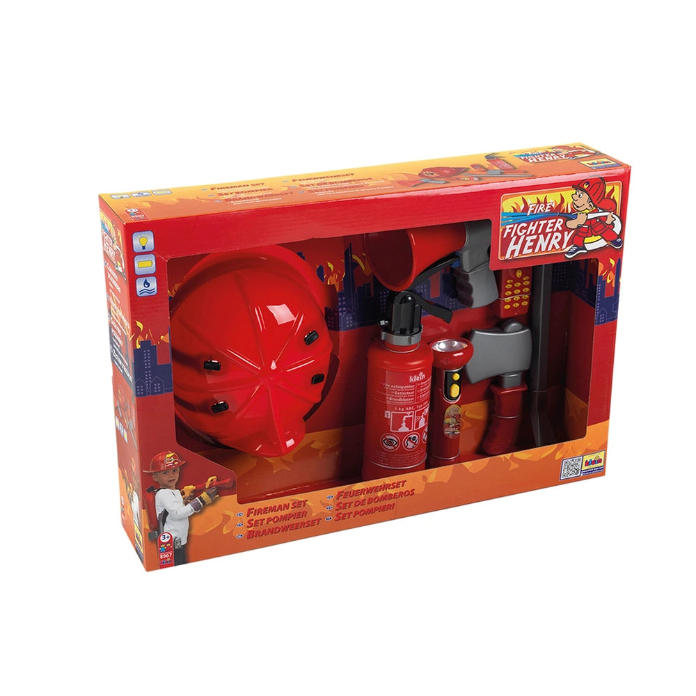 Theo Klein firefighter set featuring red helmet, hose, extinguisher, hydrant, truck, and pole in glossy cardboard packaging.