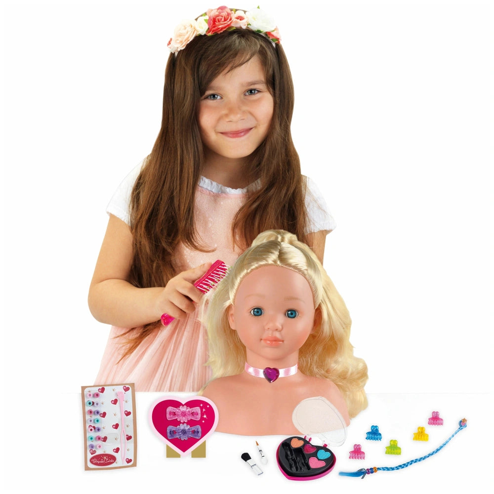Theo Klein Little Sophia make-up head with blonde hair, pink accessories, and a young girl styling her hair.