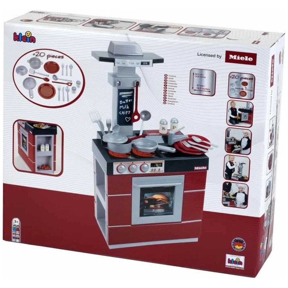 Theo Klein Miele kitchen compact toy in red and black packaging with a clear window, featuring various silver and red utensil
