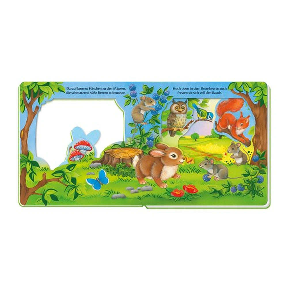 TROTSCH Little Rabbit Window Book features a vibrant illustrated scene with animals, plants, and German text in a natural set